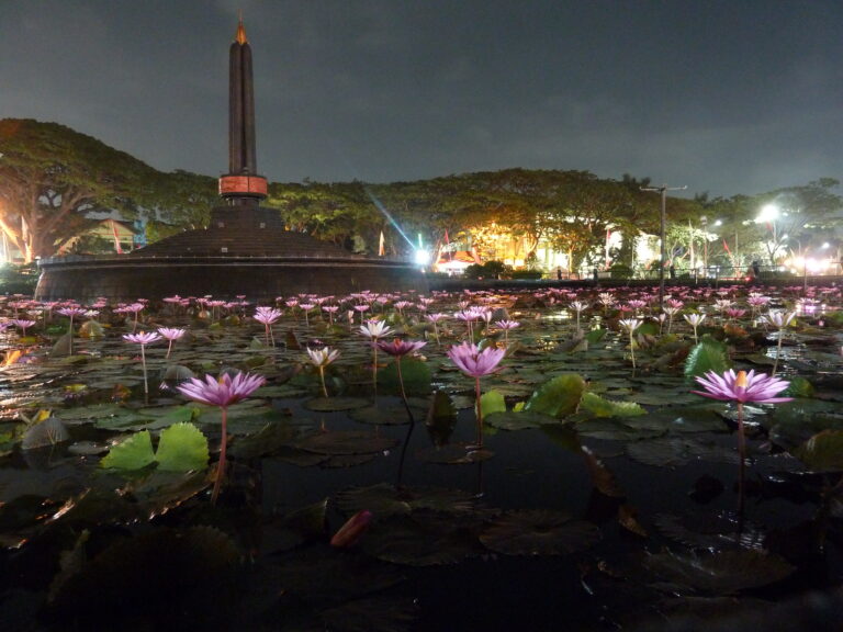 Malang, Indonesia. The lotus garden in Tugu square. Malang city hall is in the backgroud