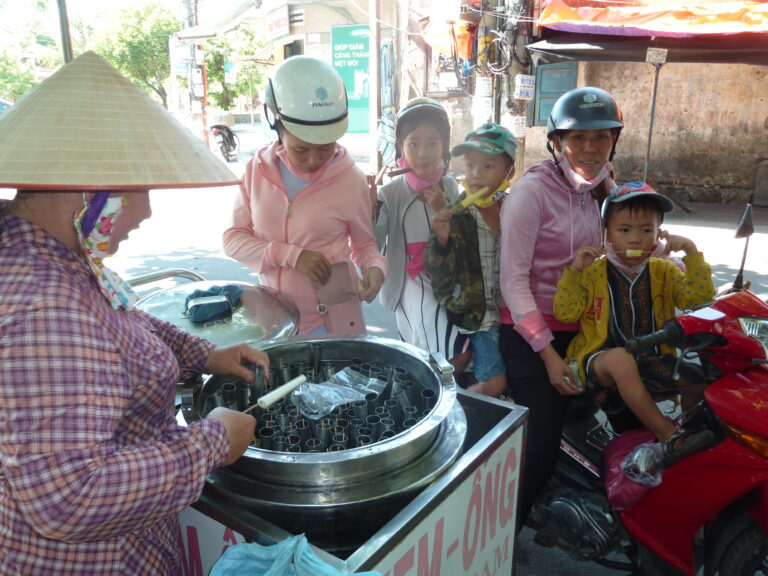 Hoi An Vietnam motorcycle children ice cream