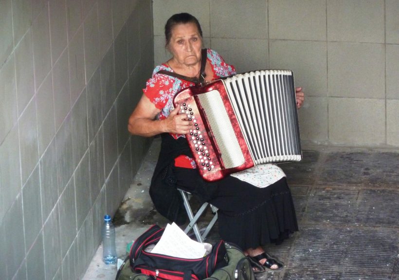 Ukraine Kyiv, lady with accordion at the entrance of the underground station (P1030084)