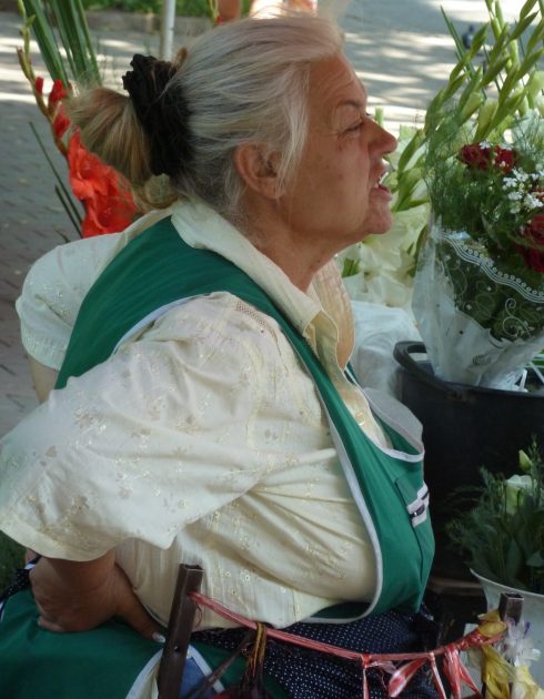 Ukraine Odessa florist flower selling lady working hard